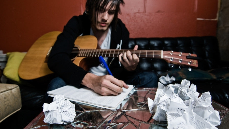 Songwriter writing song