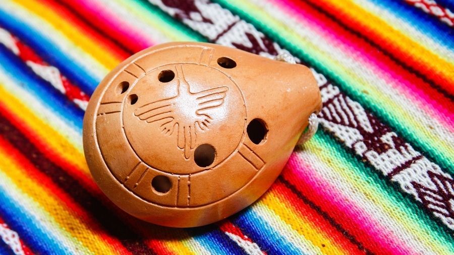 Brown Ocarina on a vibrant rainbow-colored background