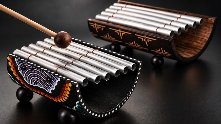 Two gamelan instruments with one being striked