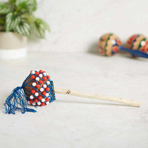 gourd shaker on stick with beads red and white
