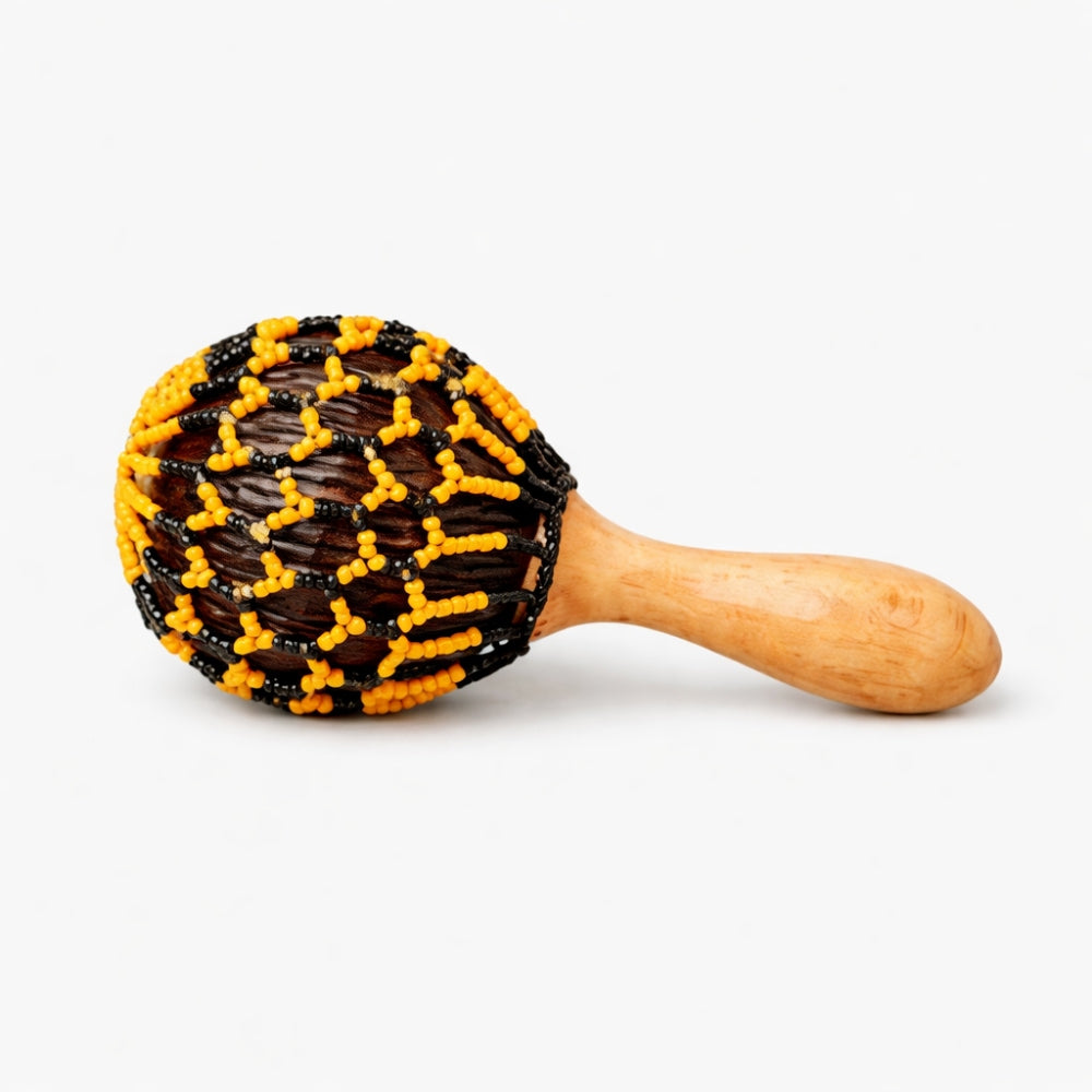Beaded Satara cabasa rattle shaker with orange and black beads with wooden handle on a white background