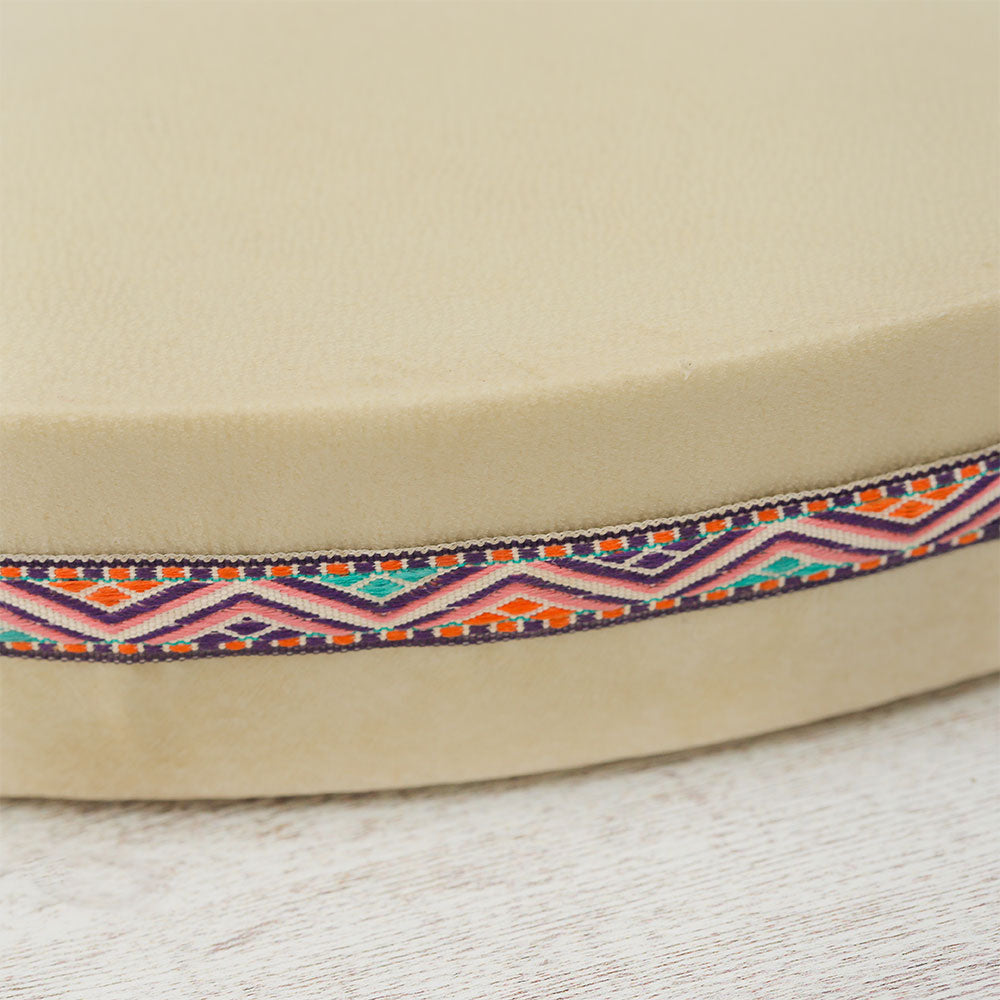 Close-up of the Besar Ocean Drum, highlighting the decorative ribbon along the edge.