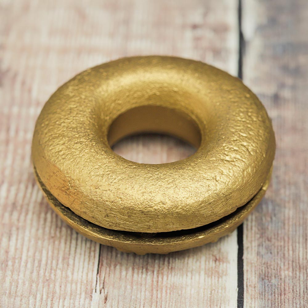 Bottom of the Brass Meo finger bell, showcasing the smooth surface.