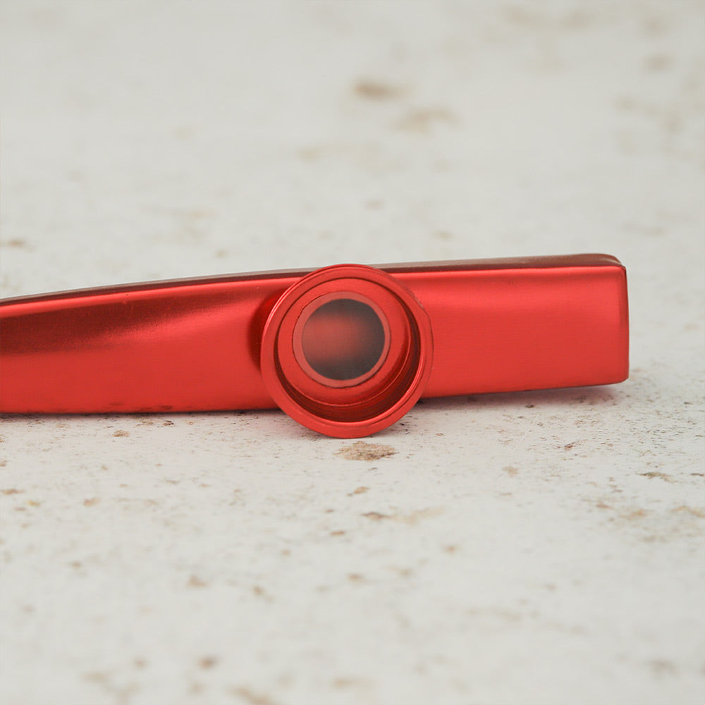 Close up of the red kazoo showing the membrane mechanism