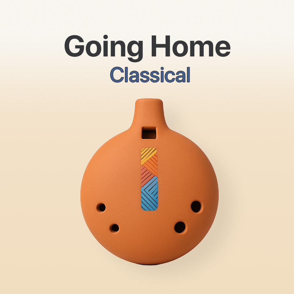 Ceramic ocarina with colorful design on a beige background, featuring the text 'Going Home Classical'.