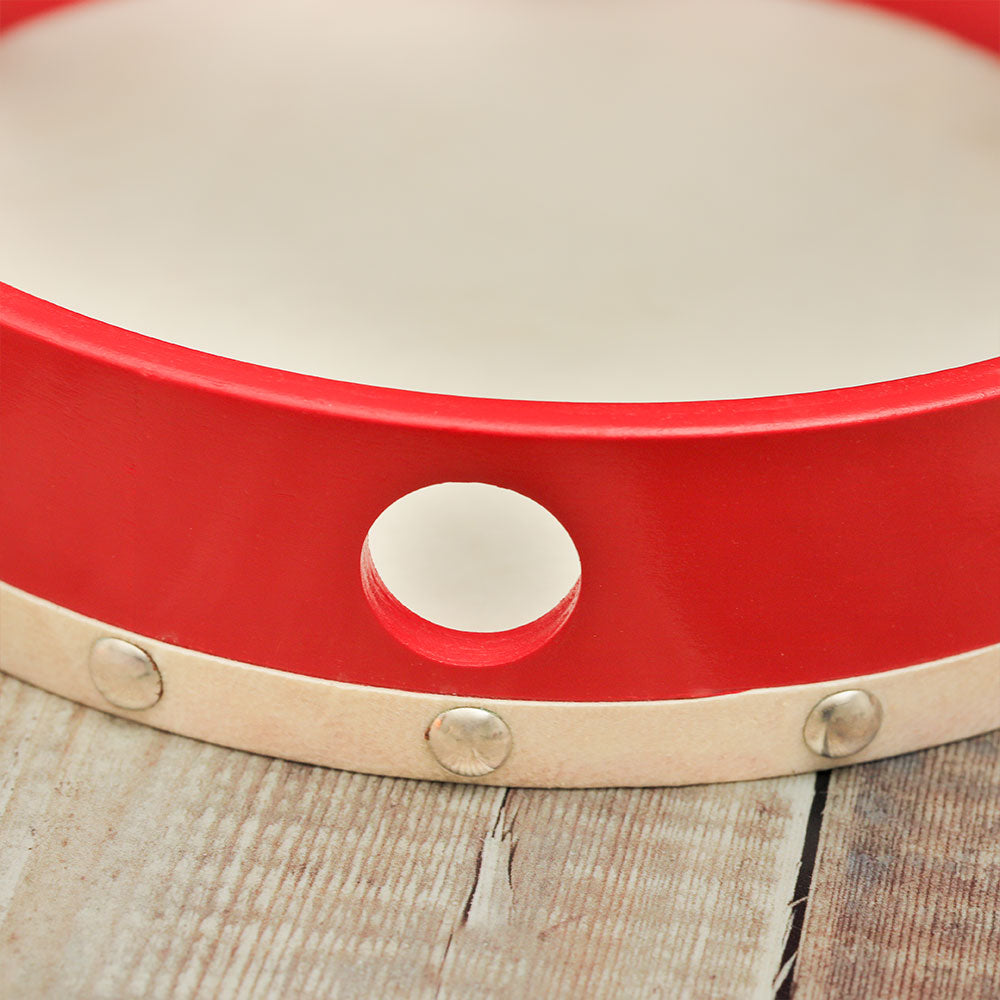 Close-up of the bottom of the Gulab Red tambourine, showcasing the frame and jingles.