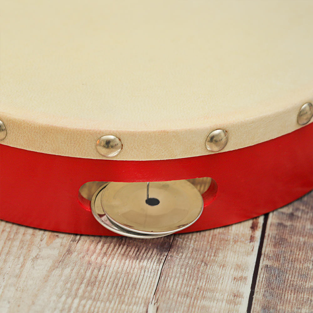 Close-up of the top of the Gulab Red tambourine, highlighting one tambour bell.