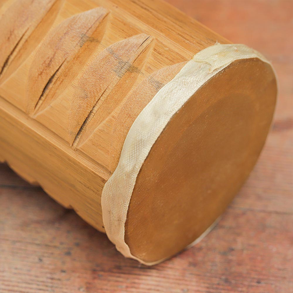 Close-up of the Jati Guiro Drum Shaker showing the guiro ridges and shaker section.