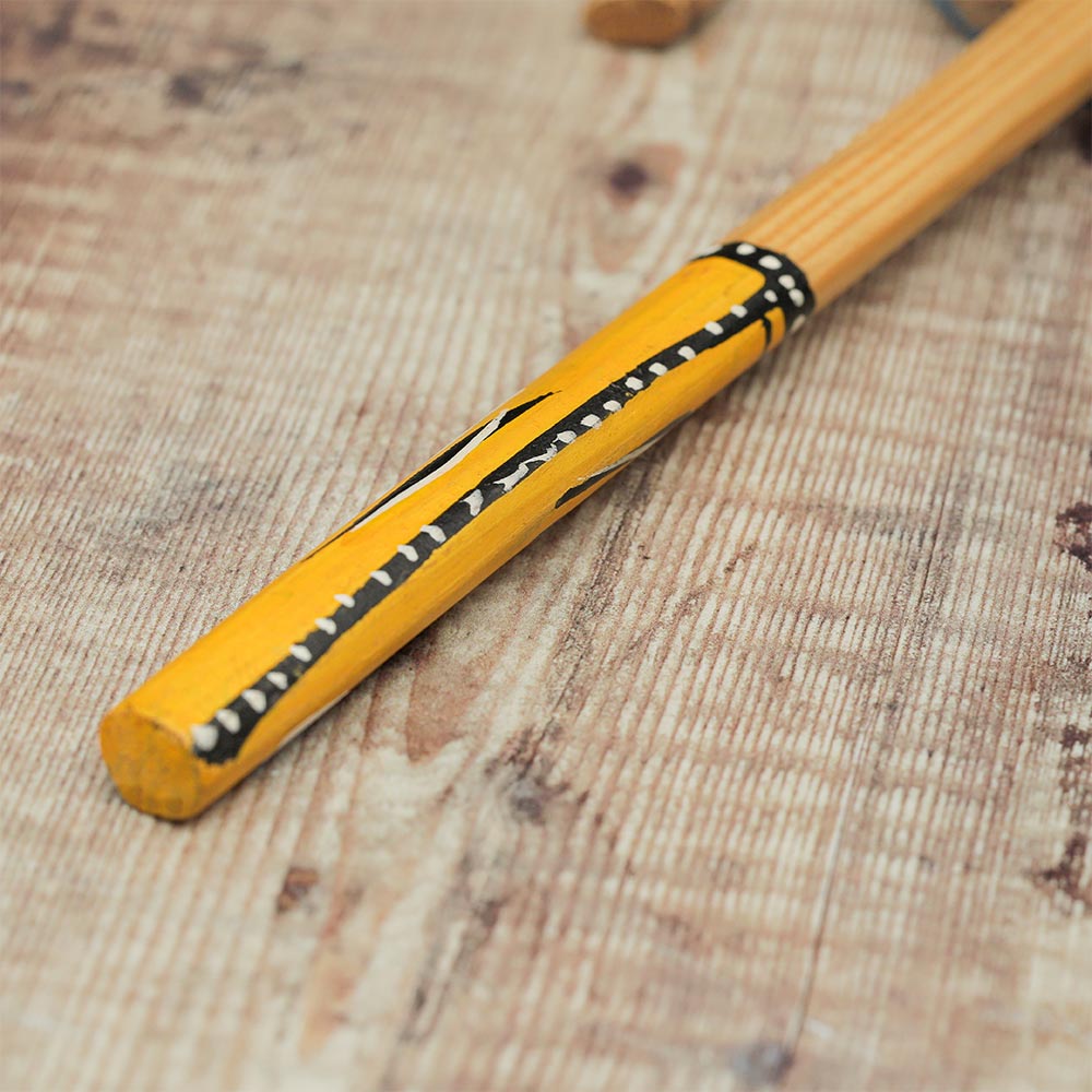 Close-up of the handle of the Kenyan Nakuru hand-painted monkey drum.