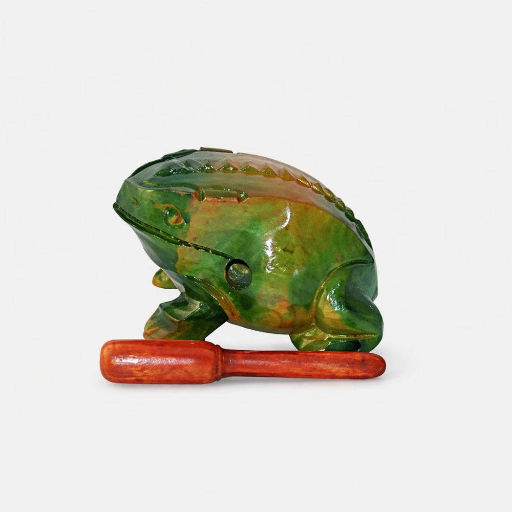3 Inch Green frog-shaped guiro with a wooden scraper on a white studio background