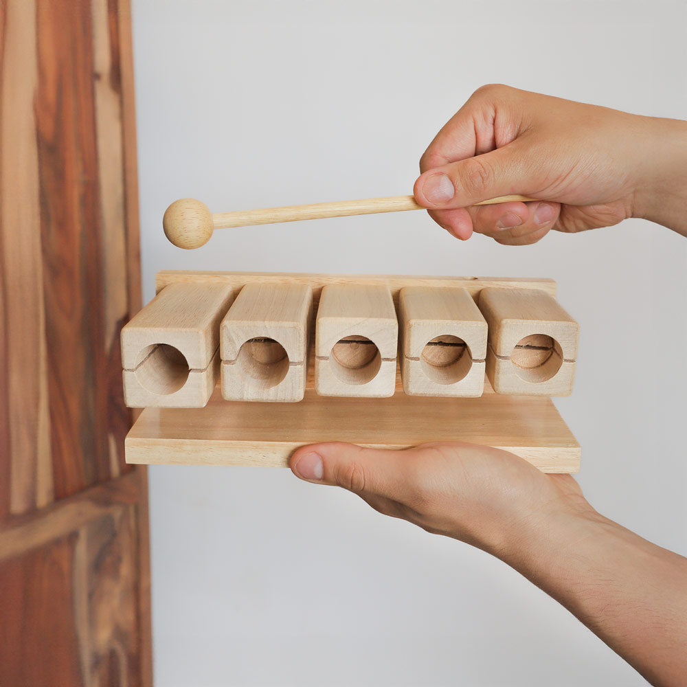 5 note tone block agogo in hand