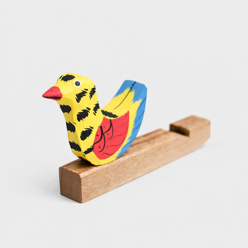 Solid Wood Indonesian Yellow Bird Whistle on a stand against a light gray studio background
