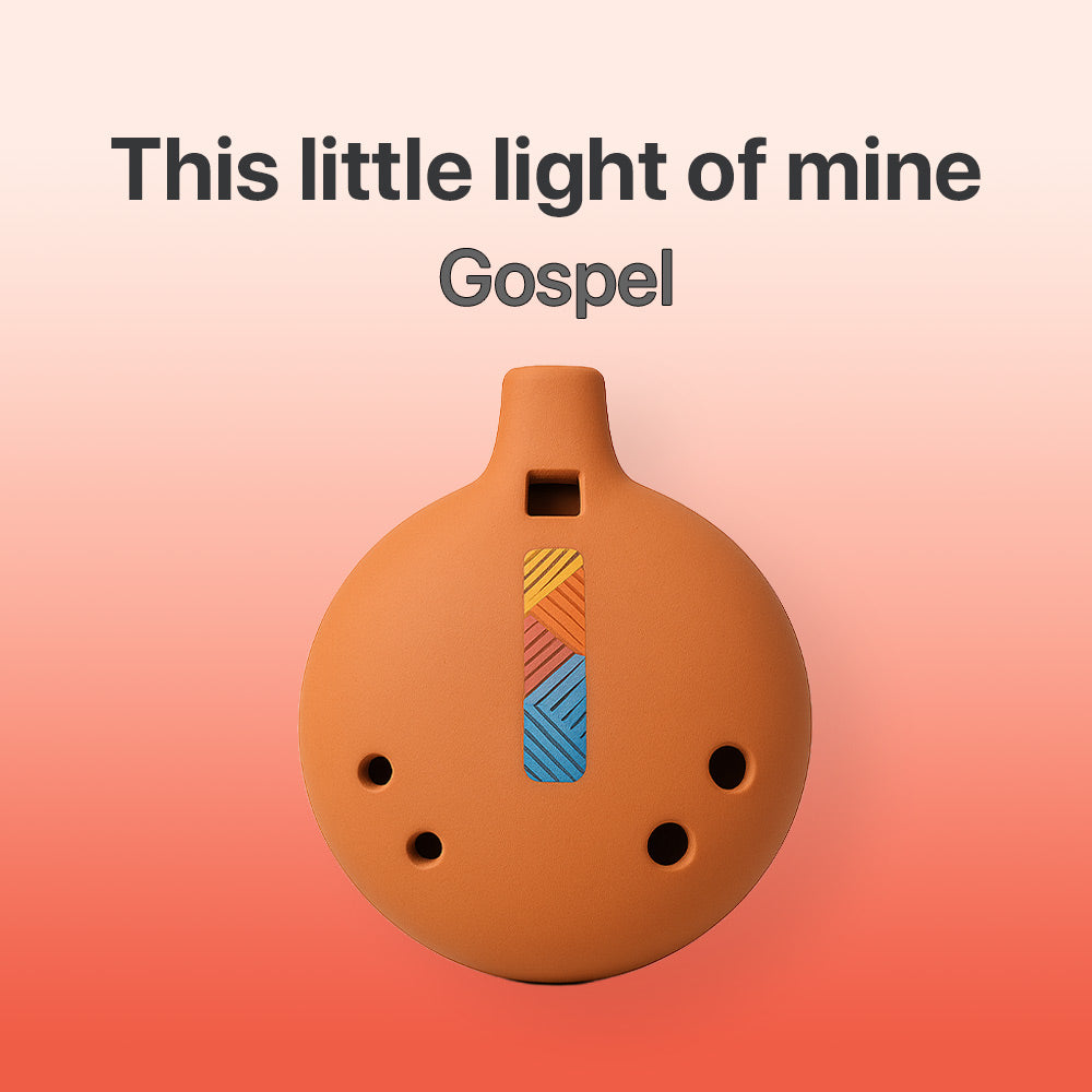 Ceramic ocarina with colorful design on a gradient background, featuring text 'This little light of mine' and 'Gospel'.