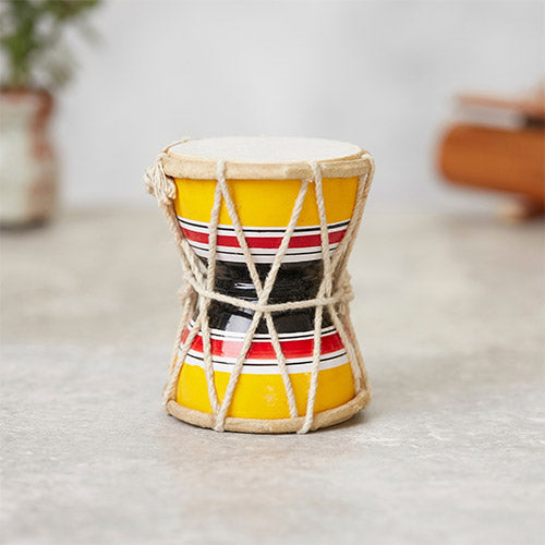 Yellow red and black traditional indian damaru drum