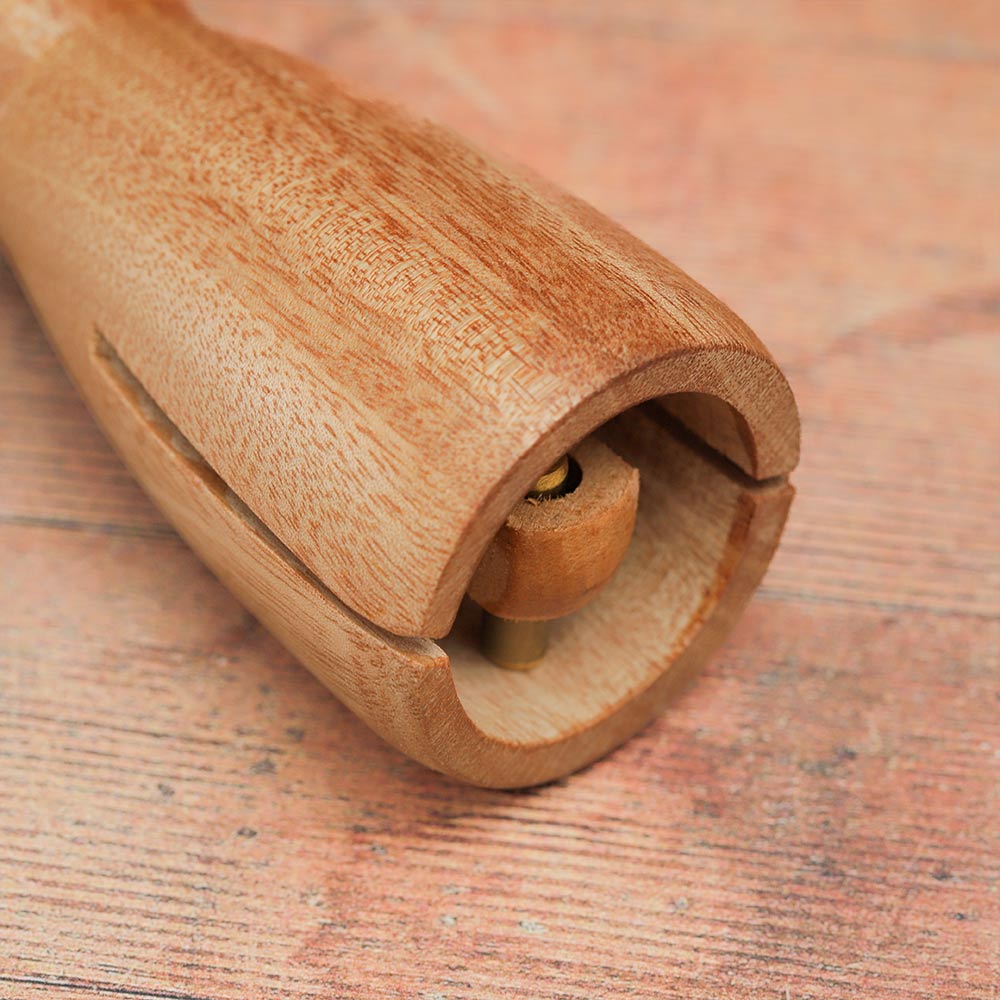 Close-up of the inside of the wooden monk bell, showcasing the knocking mechanism and its components.