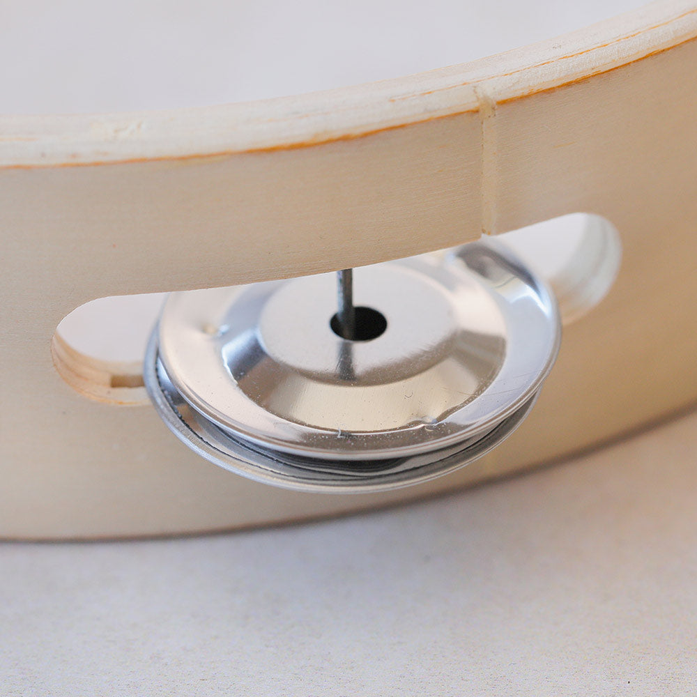 close up of dafli tambourinte bell