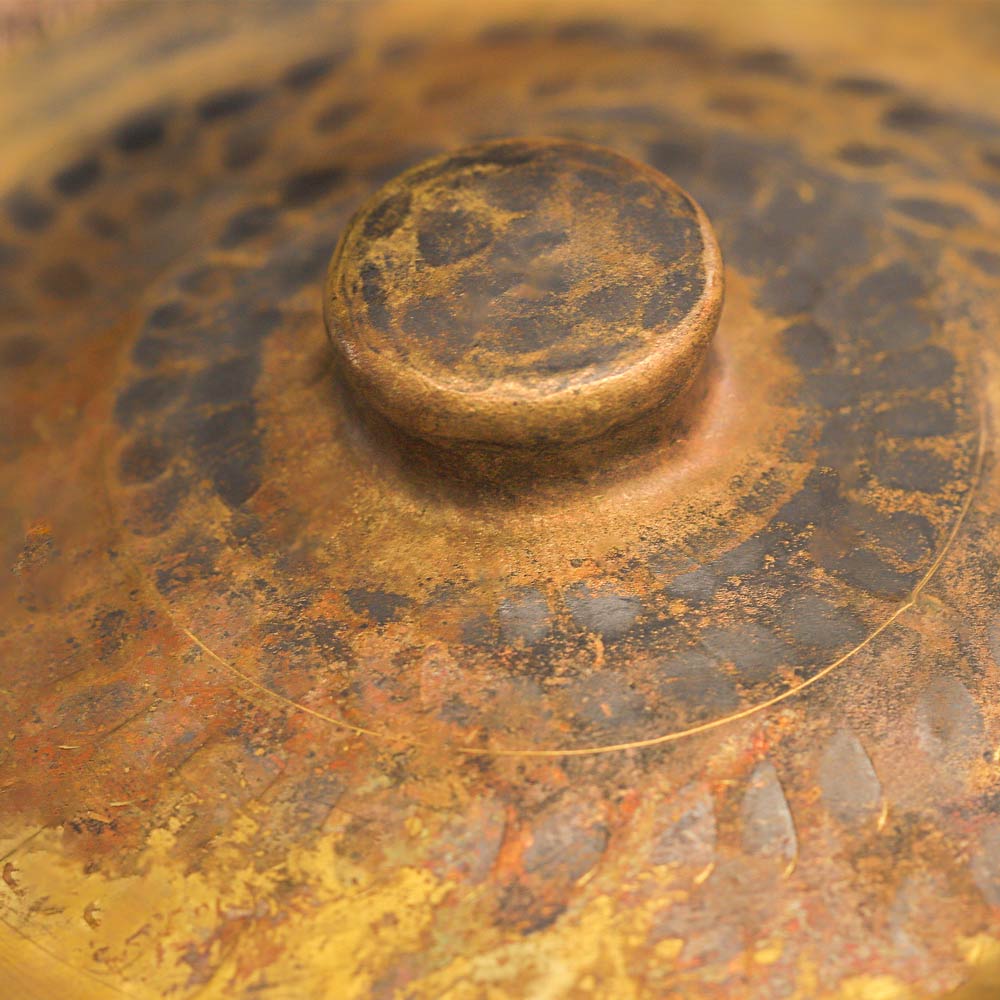 A close up of the hand cymbals