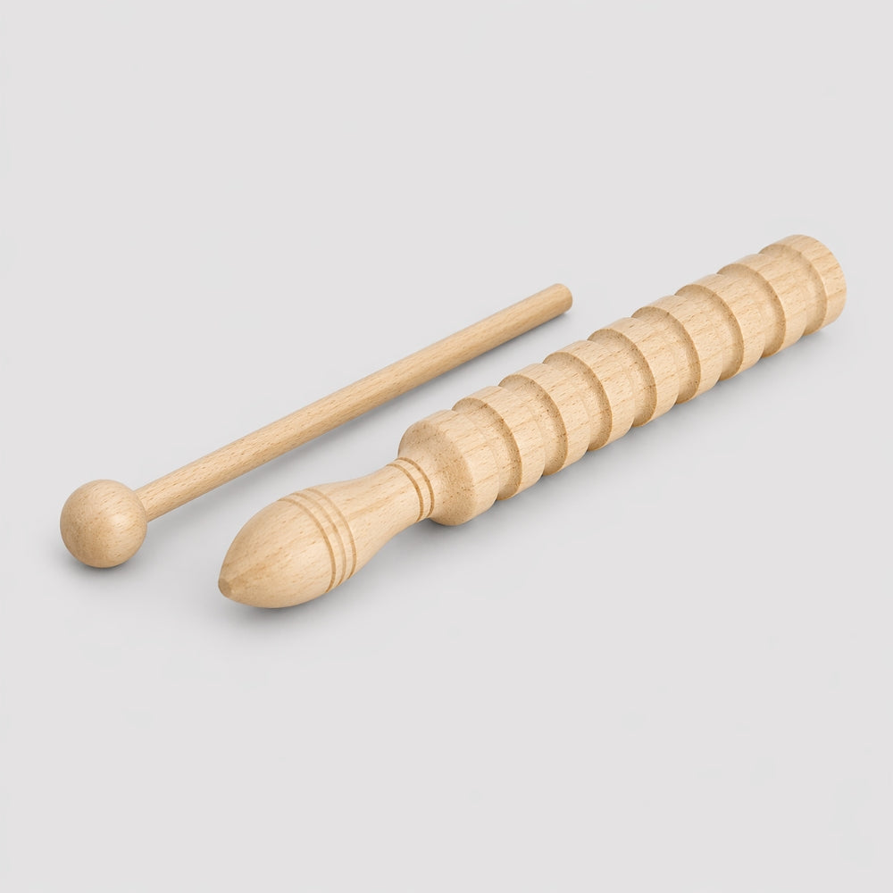 wooden guiro with rasp on white background