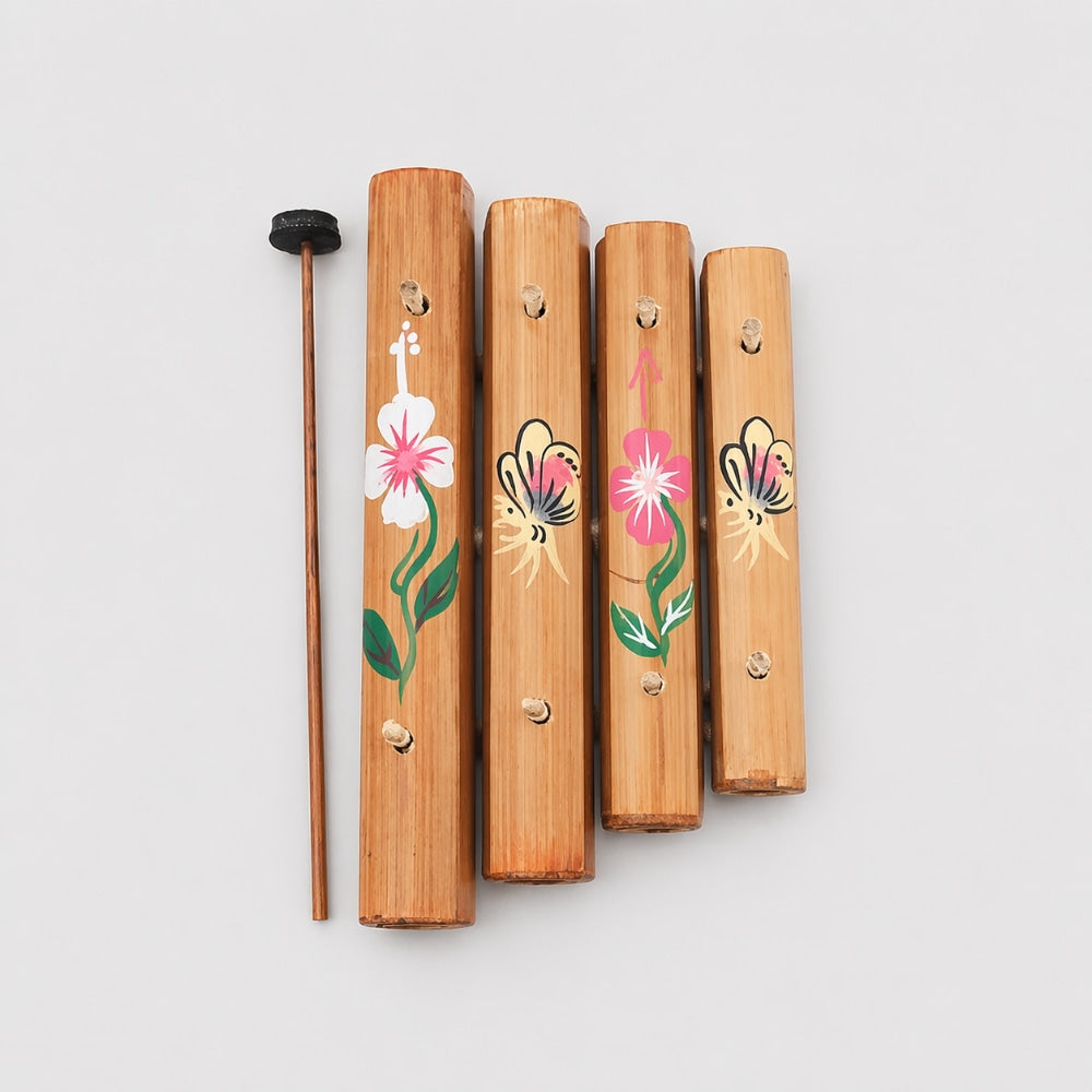 wooden xylophone with floral paintings grey background