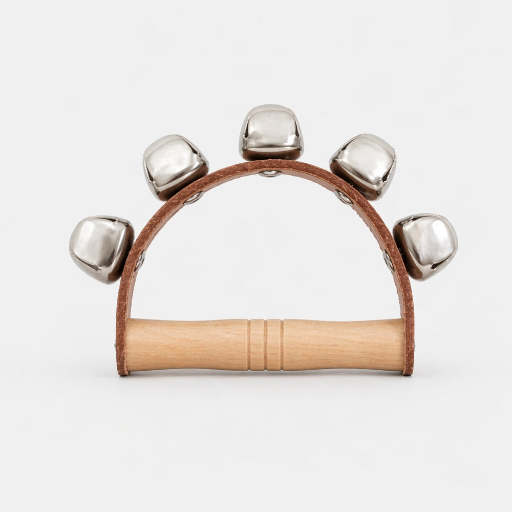 Wooden sleigh bell rattle with metal bells on a white background