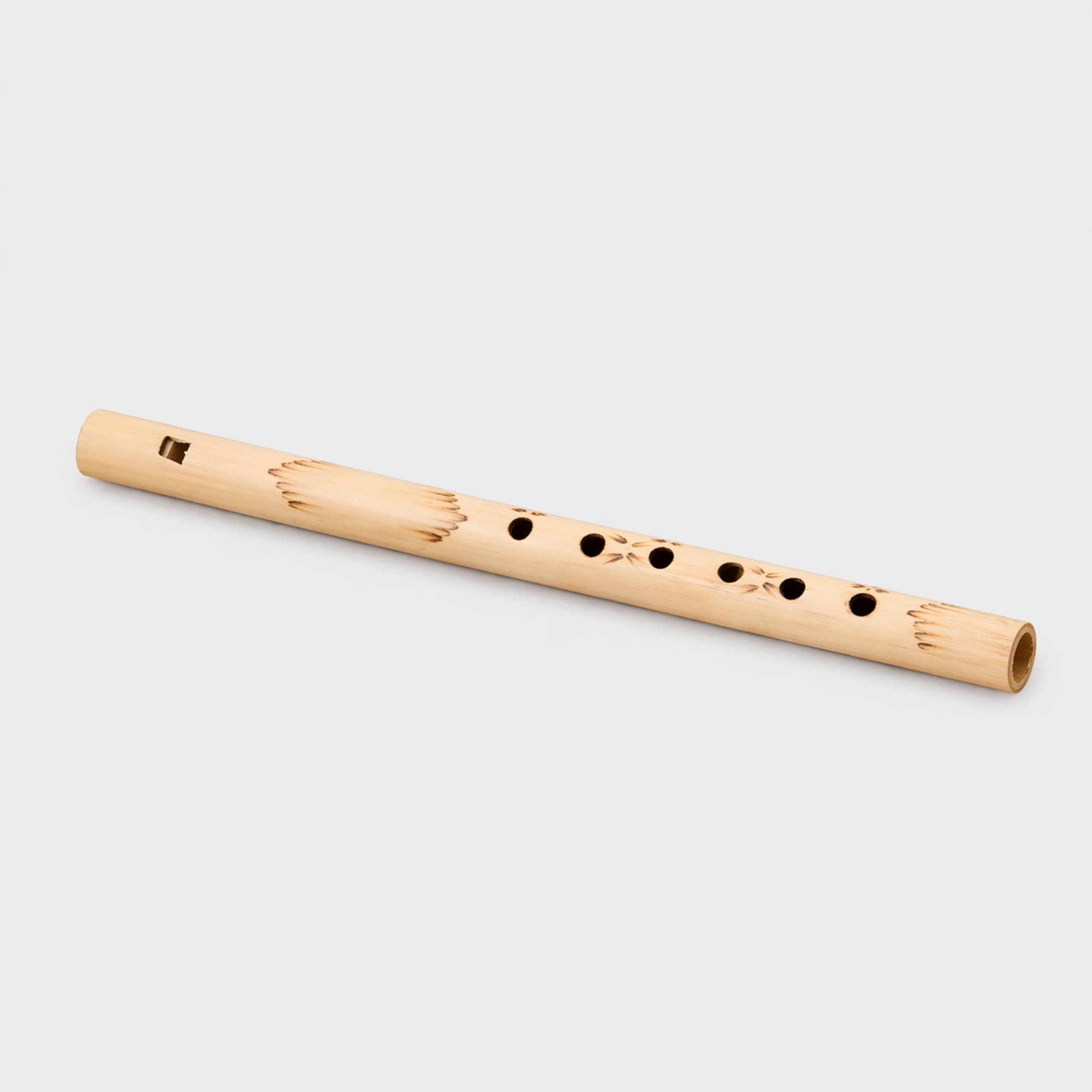 Bamboo flute on a light gray background