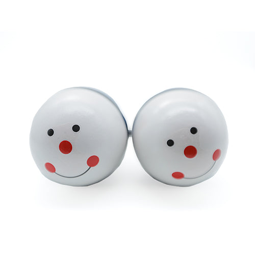 Close up of smiley faces on maraca