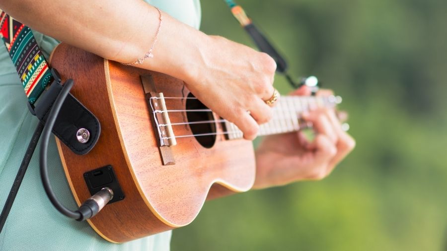 Man playing a ukulele.