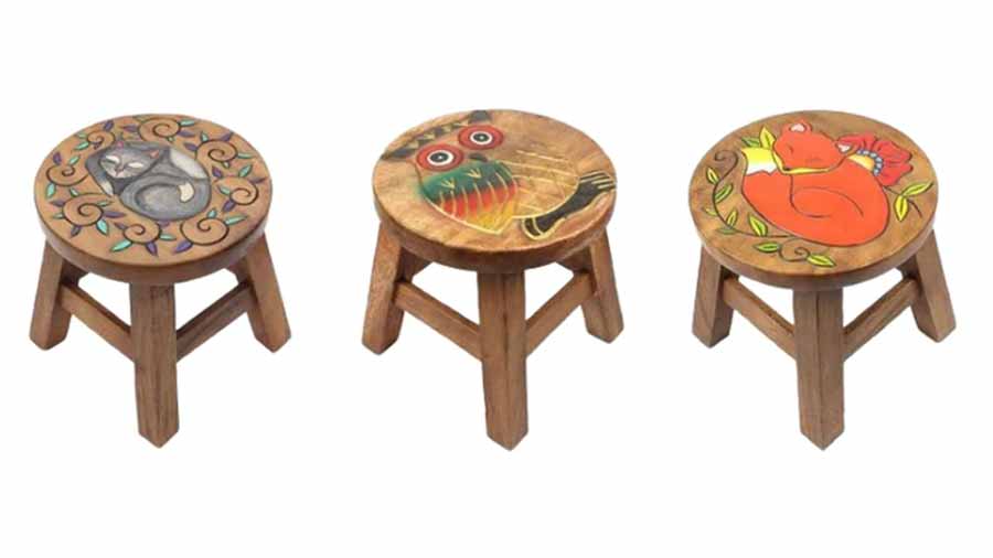 Three hand painted carved acacia wood stools