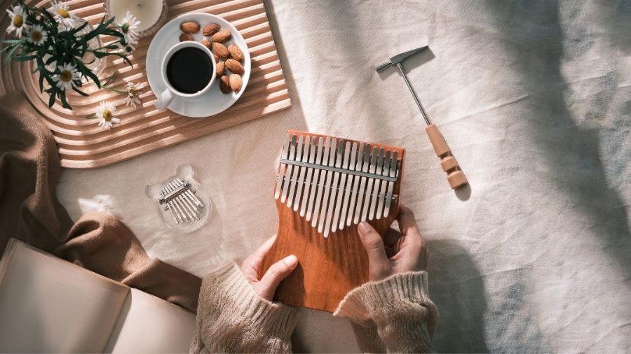 A kalimba, the African acoustic thumb piano, used for relaxation and anti-stress music, symbolizing calming sound and mindfulness techniques.