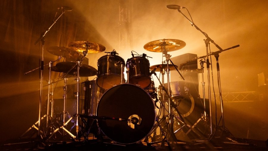 Drum Kit sillhouette and warm orange stage light 