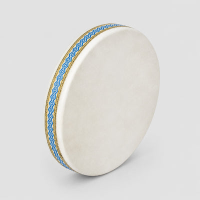 White drum with blue and gold rim on a light gray background