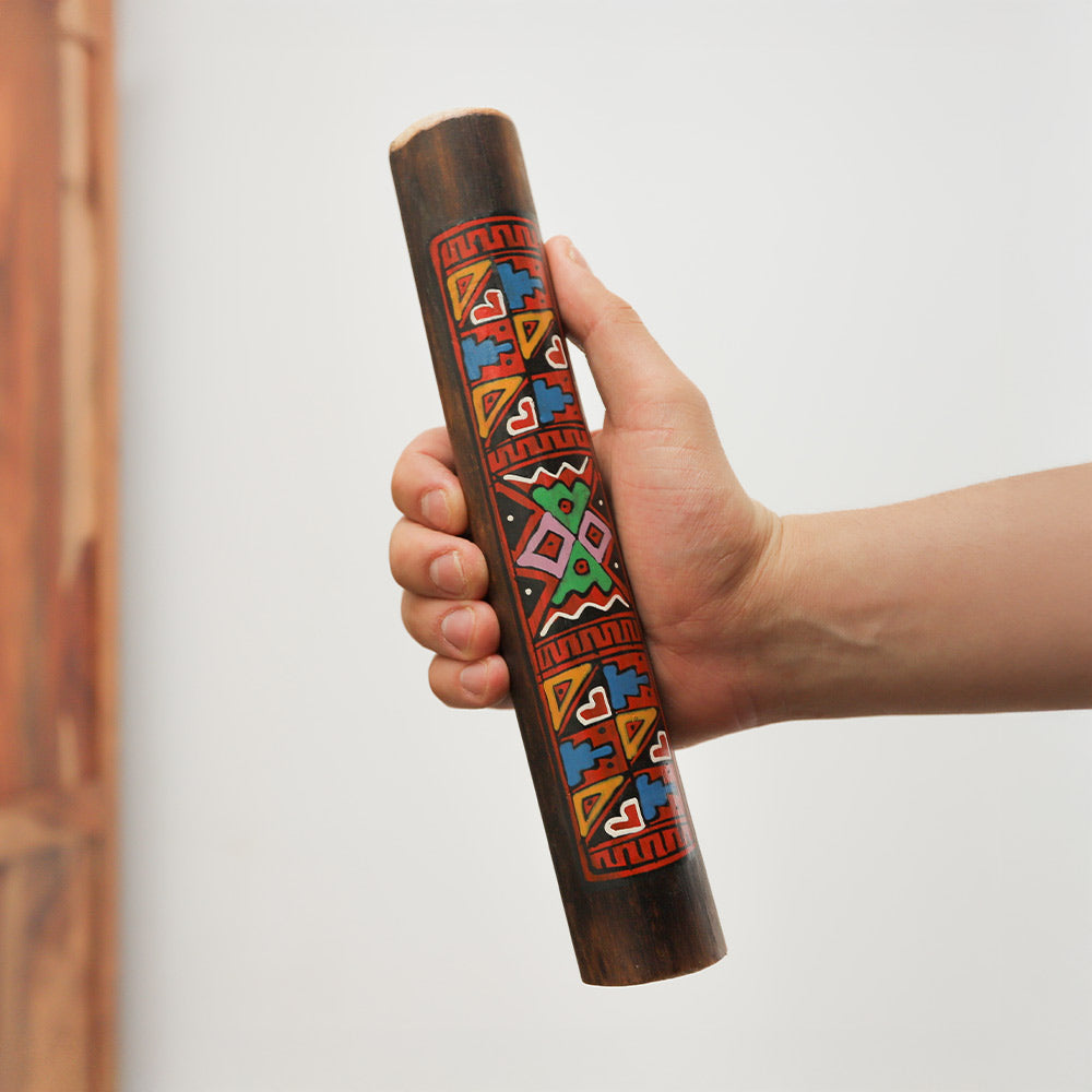 Meo finger bell, metal percussion instrument held in hand for scale