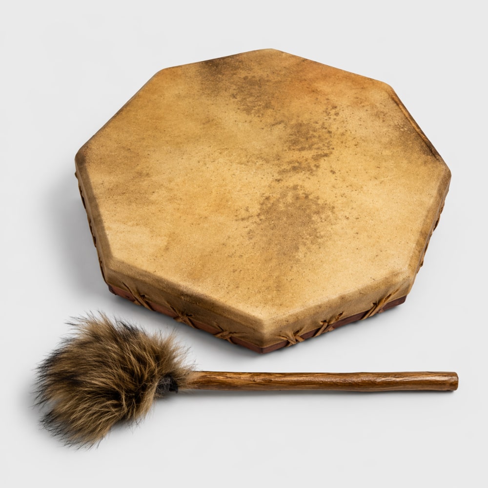 50cm Wooden hexagonal shamanic drum with a fur mallet beater on a light gray background