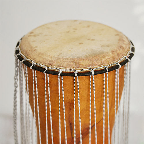 Close up of African talking drum skin