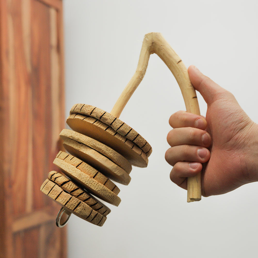 Handcrafted Gourd Rakatak from Senegal, made with calabash and metal rings. Produces authentic African percussion sounds, ideal for music and cultural appreciation.
