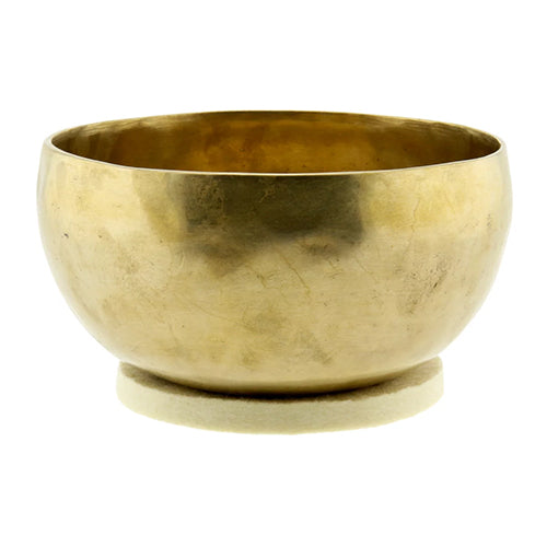 Solid round bronze singing bowl on wool cushion