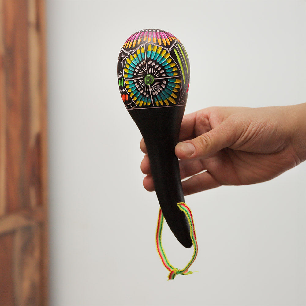 Colourful handheld Huancayo maraca, crafted from a natural gourd, hand-painted shaker percussion instrument from Peru, South America.
