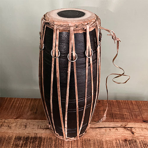 large black Madal drum 