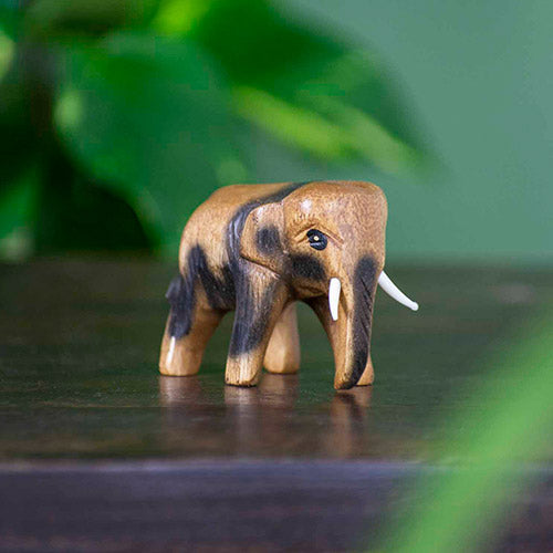 Very small wooden carved elephant figurine