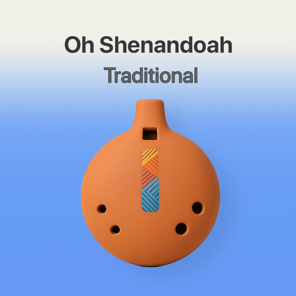 Terracotta-colored ocarina with colorful design on a blue background, labeled 'Oh Shenandoah Traditional'.