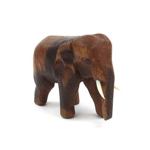 Small wooden carved elephant figurine with white background 
