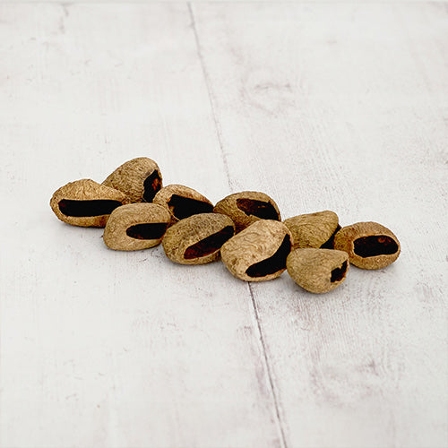 String of pangi nut cluster seeds