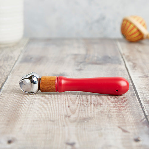 Red shaker with solid wood handle and stainless steel bell