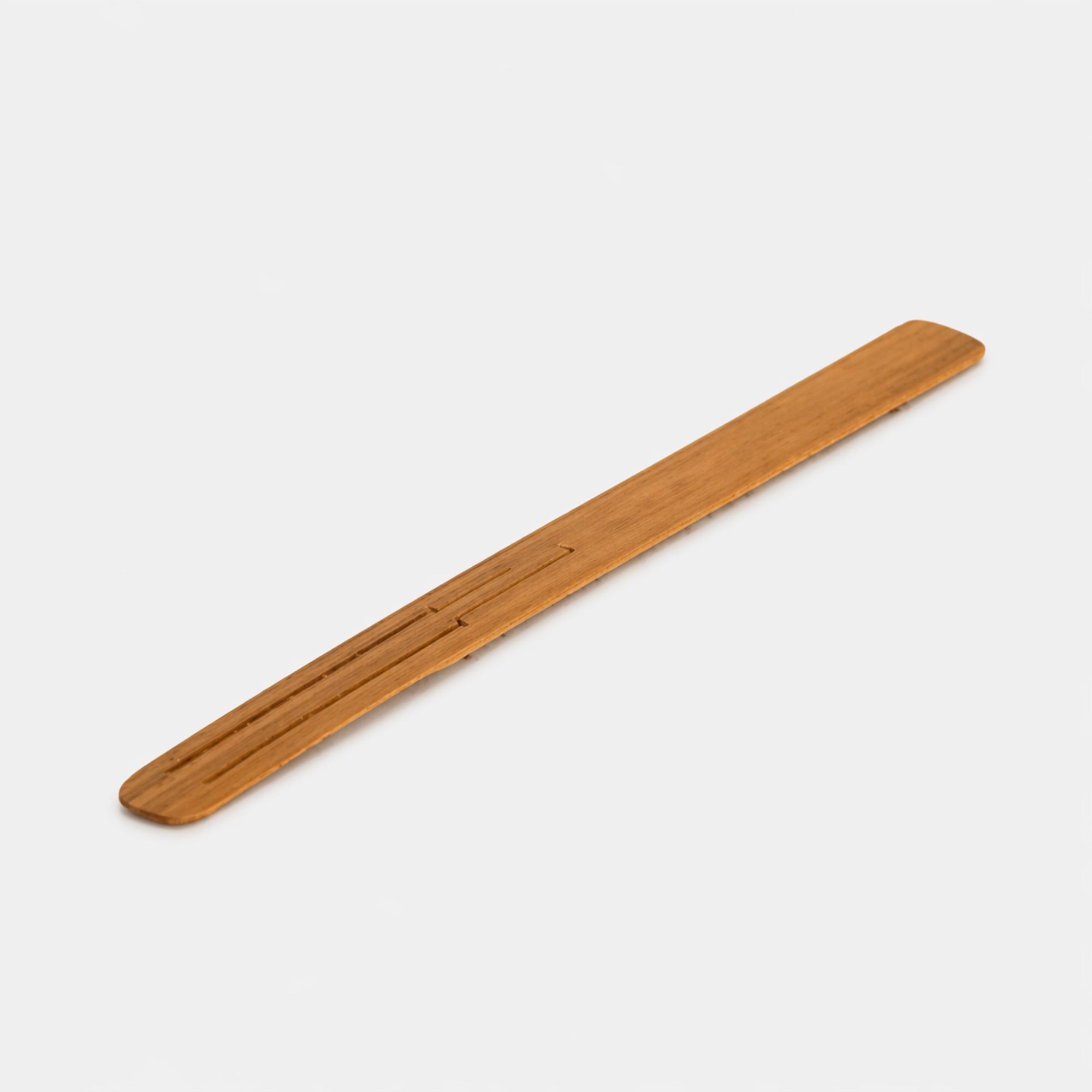 wooden bamboo jaw harp on plain white background 