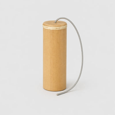 bamboo thunder drum with spring on grey background 