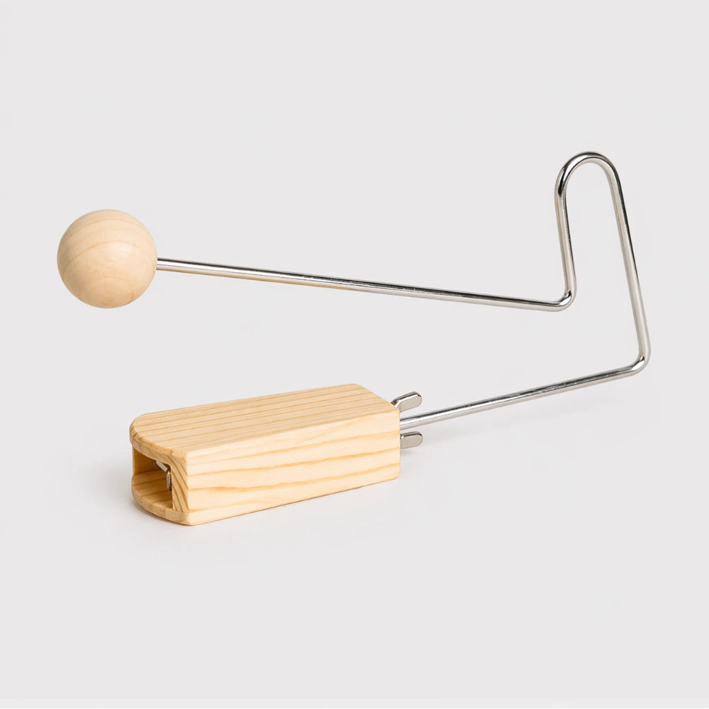 Light brown wooden and metal vibraslap instrument