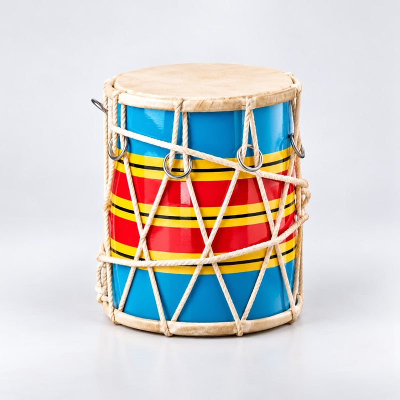 A hand-painted traditional drum with a blue body, red and yellow stripes, and a natural beige skin drumhead, wrapped in white cord with metal rings on a light gray background.