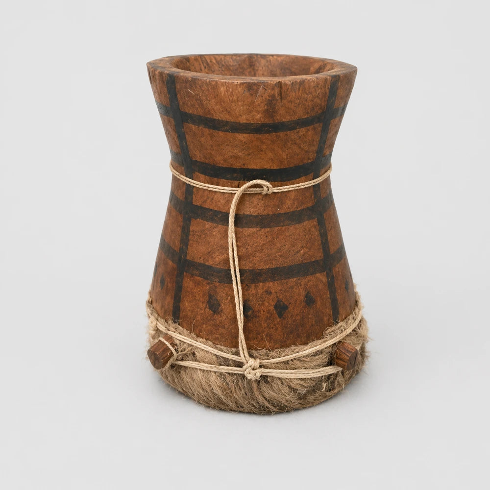 Bottom of a small African Kpanlogo drum on a white background