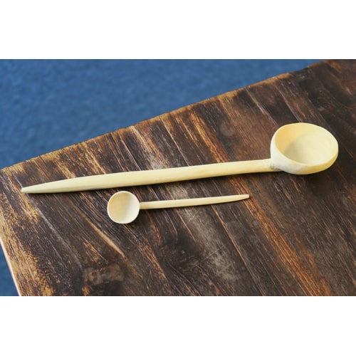 Large and small lemon wood spoon on table