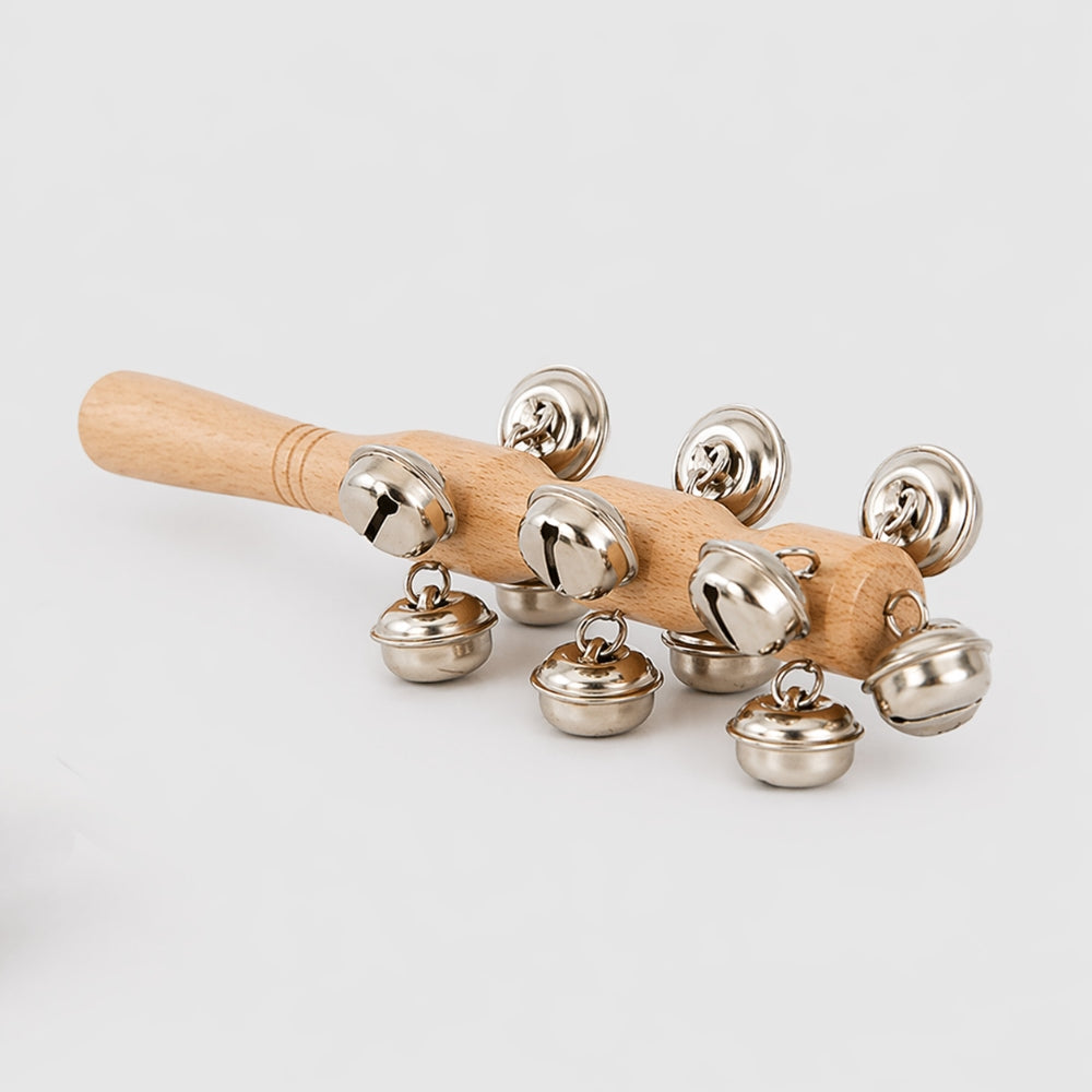 Wooden rattle with metal bells on a white background